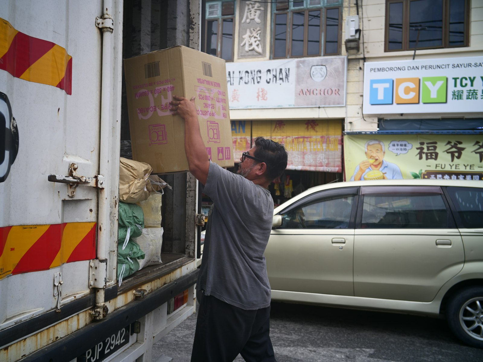Boxes being loaded into a box truck at the dock